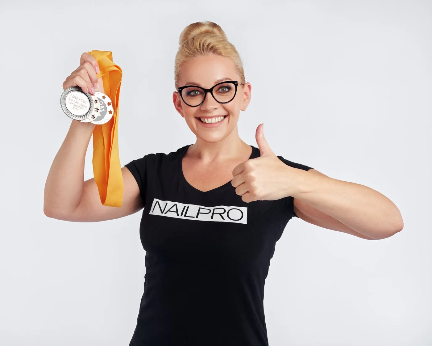 Viktoriia Klopotova with NAILPRO medals